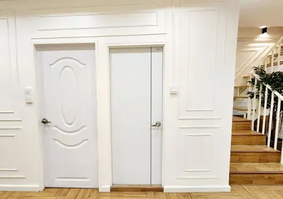 a white door in a hallway with stairs at Cozy House,4 rooms, bts ,Mega Bangna,Suvarnabhumi in Bangkok