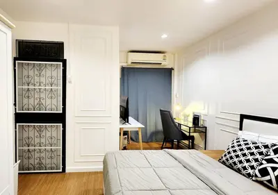 a bedroom with a bed and a desk at Cozy House,4 rooms, bts ,Mega Bangna,Suvarnabhumi in Bangkok