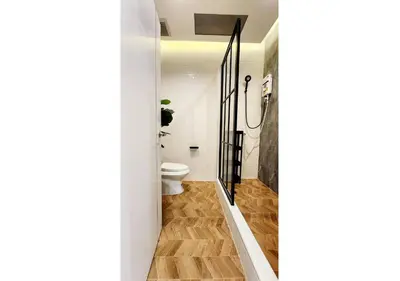 a bathroom with a toilet and a shower stall at Cozy House,4 rooms, bts ,Mega Bangna,Suvarnabhumi in Bangkok