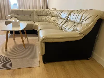 a leather couch in a living room with a table at OP Open View เมืองทอง T12 impact muang thong thani in Ban Bang Phang