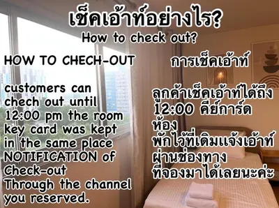 a room with a bed and a wall with the words at OP Open View เมืองทอง T12 impact muang thong thani in Ban Bang Phang