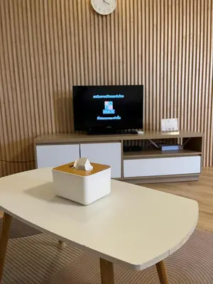 a living room with a white table and a tv at OP Open View เมืองทอง T12 impact muang thong thani in Ban Bang Phang
