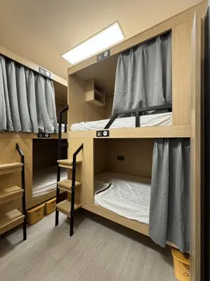 a room with two bunk beds in a dorm room at First Villa Life Hostel in Bangkok