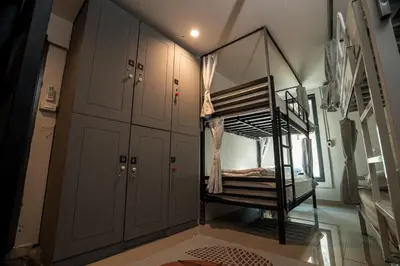 a bunk bed in a room with cabinets at Bud Brew Beyond Dispensary and Hotel in Bangkok