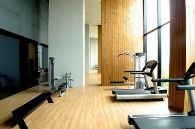 a gym with several cardio machines in a room at 1 Bedroom near MRT & BTS station. in Bangkok