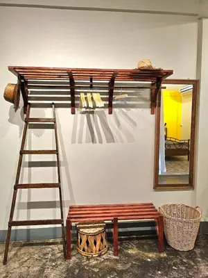 a wooden bunk bed with a ladder and a mirror at Cozy Gallery Studio at Chinatown in Bangkok