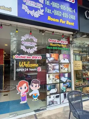 a store window with a sign for a room for rent at Orchid Inn SKV3 in Bangkok