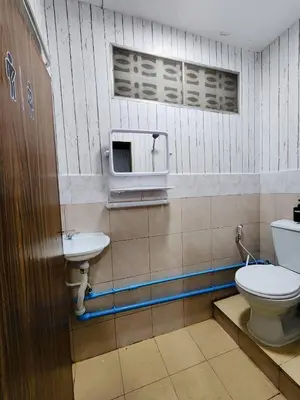 a bathroom with a toilet and a sink at 201-Olan Place Homely room Free Wi-Fi and Near BTS line in Bangkok
