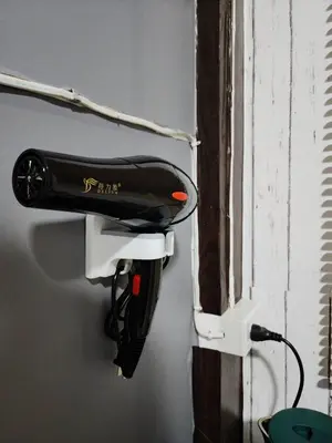a hair dryer is hanging on a wall at 201-Olan Place Homely room Free Wi-Fi and Near BTS line in Bangkok
