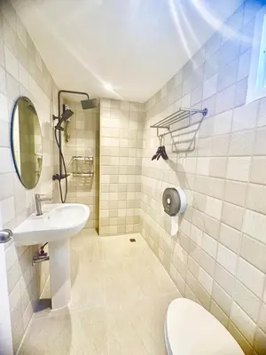 a bathroom with a sink and a toilet at ABC HA Hotel Bangkok in Bangkok
