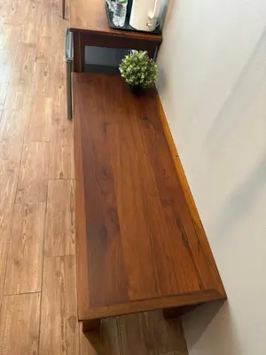 a wooden table with a potted plant on it at Rimm49 Bangkok in Bangkok