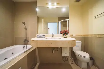 a bathroom with a sink and a toilet and a tub at Chezmoi Bangkok Sukhumvit 26 Private Executive Residence 444 in Khlong Toei
