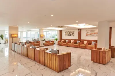 a lobby with chairs and a waiting room at Cozy Donmueang Hotel in Lak Si