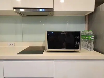 a laptop sitting on top of a kitchen counter at Condominium - Sukhumvit Soi 5 BTS Nana- Room Size 50m2 in Bangkok