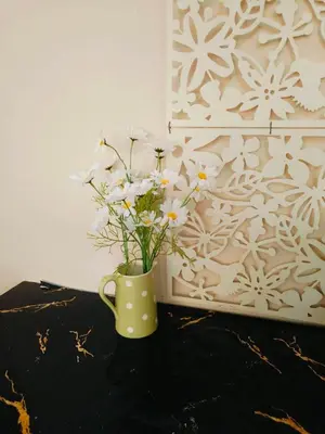 a vase with white flowers sitting on a table at SimpleRoomDesign, VeryClose Impact Muaungthongthani in Thung Si Kan