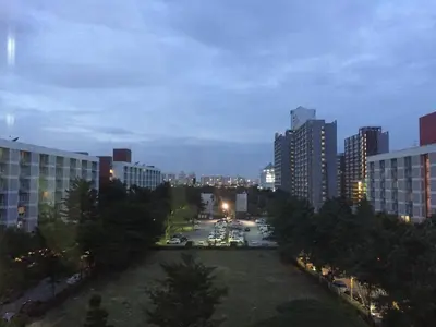 a view of a city at night with tall buildings at Savi Rooms Premium 1 Near Bkk Piyavet Hospital in Bangkok