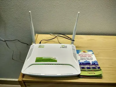 a laptop computer sitting on top of a table at Savi Rooms Premium 1 Near Bkk Piyavet Hospital in Bangkok