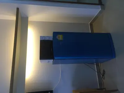 a blue box on a wall in a room at Savi Rooms Premium studio near bkk Piyavet hospital near most famous pubs in Bangkok