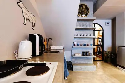 a kitchen with a stove and a stove top oven at Beautiful 3 Bedroom Baroque House near Asoke BTS in Bangkok