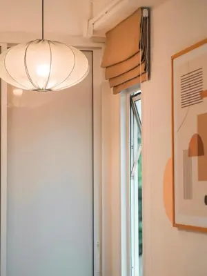 a light fixture in a hallway with a window at The Giftown Bangkok, Talat Phlu in Thonhuri