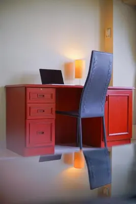 an office with a desk with a chair and a laptop at Petch Tower Ekkamai in Bangkok