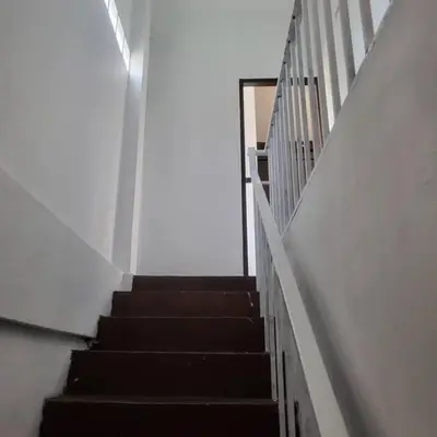 a staircase in a building with a stair case at auntythong house in Bangkok