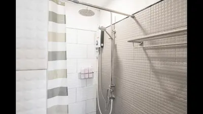 a shower in a bathroom with a shower curtain at 3A-168 House Near BTS-icon siam in Godown