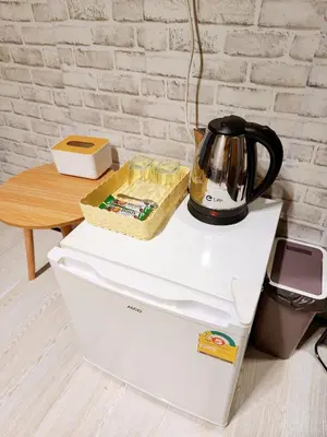 a tea kettle sitting on top of a printer at 110-Olan Place Homely room Free Wi-Fi and Near BTS line in Bangkok
