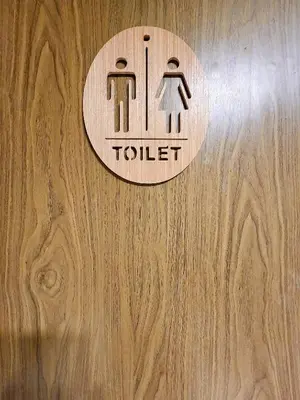 a sign on a door with a toilet sign on it at 110-Olan Place Homely room Free Wi-Fi and Near BTS line in Bangkok