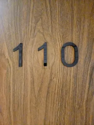 a wooden block with the on it at 110-Olan Place Homely room Free Wi-Fi and Near BTS line in Bangkok