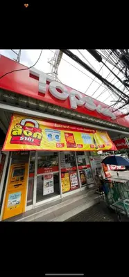 a fast food restaurant with a sign on the front of it at 110-Olan Place Homely room Free Wi-Fi and Near BTS line in Bangkok
