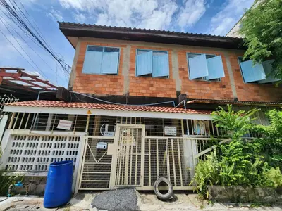 a house with a bird cage in front of it at 110-Olan Place Homely room Free Wi-Fi and Near BTS line in Bangkok