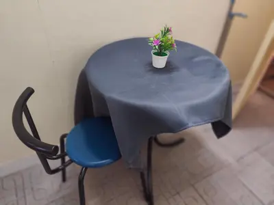 a blue table with a potted plant on it at J Place Studio 204 with nice fan free Wifi, near Skytrain in Bangkok