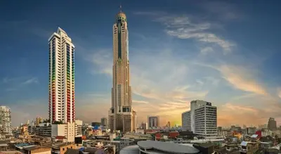 a city skyline with two tall skyscrapers at Buddy Place in Bangkok