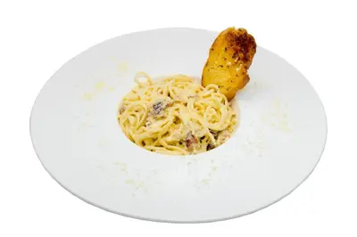 a white plate with pasta and a fry on it at New Siam Guest House in Bangkok