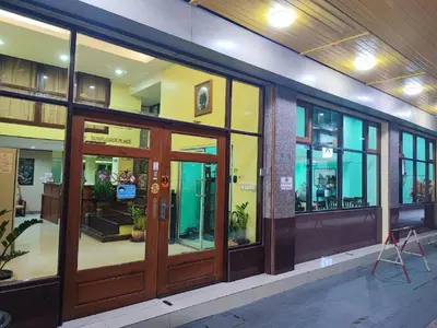 a store front with glass doors in a building at Sunflower Place in Bangkok