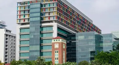 a tall building with a clock tower in front of it at OYO 730 Meedee Hostel in Bangkok