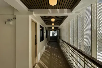 a hallway of a building with a ceiling at Parcel Hotel Bangkok in Bangkok