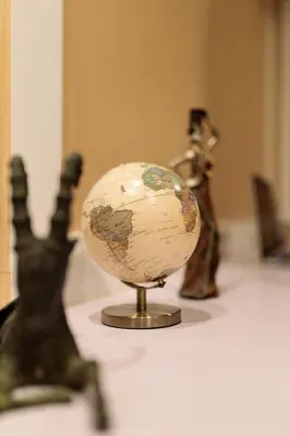a globe sitting on top of a table at Rere Hostel - รีรีโฮสเทล in Bangkok