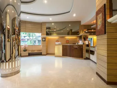 a lobby of a store with a counter at New Suanmali Hotel in Bangkok