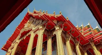 a red and gold tower of a building at Super Hostel in Nonthaburi