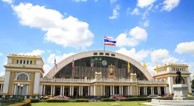 a large building with a flag on top of it at Chamberlain Bangkok in Bangkok