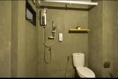 a bathroom with a shower with a toilet in it at Bangkok Silom chat box hostel in Bangkok