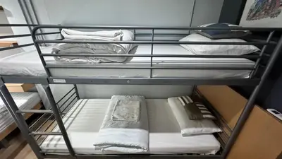 a group of bunk beds in a room at Bangkok Silom chat box hostel in Bangkok