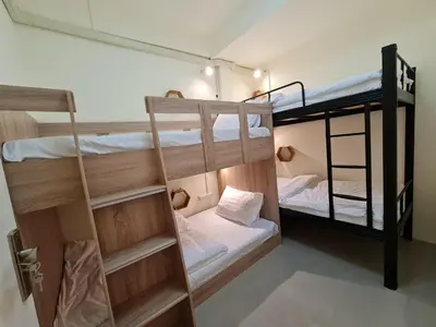 a room with two bunk beds and a ladder at De Chalet in Bangkok