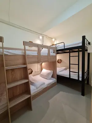 a room with two bunk beds in it at De Chalet in Bangkok