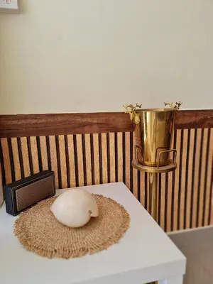 a white computer mouse sitting on top of a table at De Chalet in Bangkok