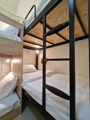 a bunk bed room with two bunk beds at De Chalet in Bangkok