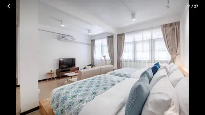 a hotel room with two beds and a television at 168 House 3B Near BTS iconsiam in Godown