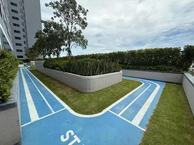 a blue painted basketball court in a city at Cozy Downtown Apartment - long stay in Bangkok- MRT Phasi charoen in Bangkok